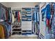 Walk-in closet with custom shelving and ample storage space for clothing and shoes at 12614 Robert Walker Dr, Davidson, NC 28036