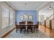 Elegant dining room featuring hardwood floors, stylish lighting, and ample seating at 12614 Robert Walker Dr, Davidson, NC 28036
