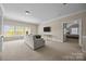 Bright living room with neutral walls, carpet flooring and plenty of natural light at 12614 Robert Walker Dr, Davidson, NC 28036