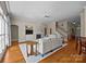 Comfortable living room boasts a fireplace, built-in shelves, and hardwood floors at 12614 Robert Walker Dr, Davidson, NC 28036