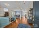 Inviting living room featuring an open floor plan, hardwood floors, and lots of natural light at 12614 Robert Walker Dr, Davidson, NC 28036