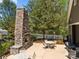 Outdoor fireplace and seating near a community pool offer relaxation and entertaining space at 12614 Robert Walker Dr, Davidson, NC 28036