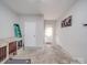 Spacious basement with concrete flooring, a sturdy dog crate, and a secure white door to the outside, ready for customization at 1315 Holshouser Rd, Rockwell, NC 28138
