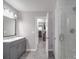 Bathroom features a gray vanity with modern fixtures, and a glass-enclosed shower at 1315 Holshouser Rd, Rockwell, NC 28138