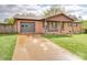 This traditional-style home features a convenient attached garage and classic brick facade at 1315 Holshouser Rd, Rockwell, NC 28138