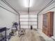 Clean garage space with white walls, overhead door, and ample storage options at 1315 Holshouser Rd, Rockwell, NC 28138