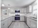 Beautiful kitchen with stainless appliances, granite countertops, subway tile backsplash, and a modern faucet and sink at 1315 Holshouser Rd, Rockwell, NC 28138