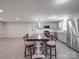 Open-concept kitchen featuring stainless steel appliances, granite countertops, and an eat-in island with bar stools at 1315 Holshouser Rd, Rockwell, NC 28138