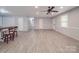 Spacious living room featuring neutral walls, wood-look flooring, and ample lighting at 1315 Holshouser Rd, Rockwell, NC 28138