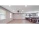 Open-concept living room and kitchen featuring neutral walls, wood-look flooring, and ample natural light at 1315 Holshouser Rd, Rockwell, NC 28138