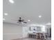 Open-concept kitchen and living room with stainless steel appliances and modern ceiling fan at 1315 Holshouser Rd, Rockwell, NC 28138