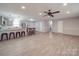 Open-concept living room featuring neutral walls, wood-look flooring, and a modern ceiling fan at 1315 Holshouser Rd, Rockwell, NC 28138