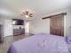Comfortable bedroom featuring a barn-style closet door and neutral walls at 1315 Holshouser Rd, Rockwell, NC 28138