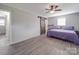 Bedroom featuring a barn door closet and neutral walls with wood-look flooring at 1315 Holshouser Rd, Rockwell, NC 28138
