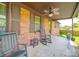Cozy covered porch featuring rocking chairs, offering a relaxing outdoor space at 1315 Holshouser Rd, Rockwell, NC 28138