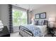 Charming bedroom featuring a decorative window, a comfortable bed, and stylish accents at 13304 Chopin Ridge Dr, Huntersville, NC 28078
