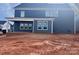 Back of the new construction two-story home features a covered patio and ample windows for natural light at 13304 Chopin Ridge Dr, Huntersville, NC 28078