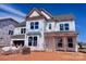 New two-story home featuring large windows and a modern architectural design under construction at 13304 Chopin Ridge Dr, Huntersville, NC 28078