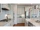 Modern kitchen with stainless steel appliances, a cooktop, and light grey cabinets at 13304 Chopin Ridge Dr, Huntersville, NC 28078