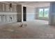 Spacious living room with drywall, featuring bright windows and customizable design at 13304 Chopin Ridge Dr, Huntersville, NC 28078