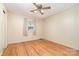 Empty bedroom with hardwood floors, natural light, and ceiling fan at 1331 Mccorkle Rd, Charlotte, NC 28214