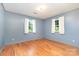 Bedroom with hardwood floors, natural light, and fresh paint at 1331 Mccorkle Rd, Charlotte, NC 28214