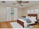 Bright bedroom features neutral walls, hardwood floors, a bed with wooden frame and white bedding at 1331 Mccorkle Rd, Charlotte, NC 28214