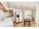 Bright kitchen features white cabinetry, wood floors, modern appliances, and updated lighting at 1331 Mccorkle Rd, Charlotte, NC 28214