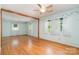 Bright living room featuring hardwood floors, complemented by natural light streaming through multiple windows at 1331 Mccorkle Rd, Charlotte, NC 28214