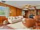 Bright living room features neutral walls and cream colored seating and light colored rug and ceiling fan at 1331 Mccorkle Rd, Charlotte, NC 28214