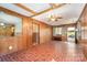 Spacious living room with dark paneling, brick-look flooring and an open entryway at 1331 Mccorkle Rd, Charlotte, NC 28214