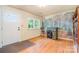 Charming office space with hardwood floors, forest scene wallpaper, desk and ample natural light at 1331 Mccorkle Rd, Charlotte, NC 28214