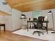 Bright and airy office with desk, chair, lamp, hardwood floors, and neutral colored walls at 1331 Mccorkle Rd, Charlotte, NC 28214
