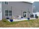 Well-maintained backyard featuring a patio area with seating and planters, ideal for enjoying outdoor living at 1347 Mifflin Ln, Dallas, NC 28034