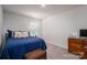 Bedroom with dark wood desk, trunk, and bright window; offers a cozy and relaxing space at 1347 Mifflin Ln, Dallas, NC 28034