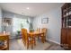 Inviting dining room with a wooden table, chairs, and natural light at 1347 Mifflin Ln, Dallas, NC 28034