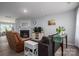 Cozy living room featuring a fireplace, comfortable seating, and natural light at 1347 Mifflin Ln, Dallas, NC 28034