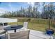 Back patio featuring an outdoor dining set, chairs, and view of fenced yard space at 1347 Mifflin Ln, Dallas, NC 28034