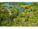 Beautiful aerial view of the lush, green neighborhood with waterfront access to a pristine lake at 143 Ross Rd, Mooresville, NC 28117