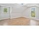 Bright bedroom with wood floors and natural light showcases a cozy and inviting space at 143 Ross Rd, Mooresville, NC 28117