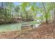 Private wooden dock provides access to calm lake waters and wooded shoreline at 143 Ross Rd, Mooresville, NC 28117