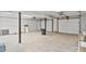 Large, unfinished garage space with multiple bays offers potential for storage or customization at 143 Ross Rd, Mooresville, NC 28117