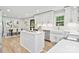 Bright kitchen with stainless steel appliances, white cabinetry, and a view into the dining room at 143 Ross Rd, Mooresville, NC 28117