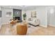 Cozy living room with brick fireplace, hardwood floors, and stylish furnishings creating a relaxing atmosphere at 143 Ross Rd, Mooresville, NC 28117