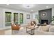 Inviting living room with a cozy fireplace and large glass doors leading to the outdoor area at 143 Ross Rd, Mooresville, NC 28117