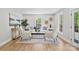 Bright living room featuring neutral tones, stylish decor, and natural light from large windows at 143 Ross Rd, Mooresville, NC 28117