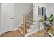 Staircase with wooden steps, black iron railings, leading to the upper level at 143 Ross Rd, Mooresville, NC 28117