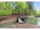 Beautiful waterfront with a private boat dock in a serene, wooded setting at 143 Ross Rd, Mooresville, NC 28117