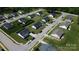 An aerial view shows a neighborhood with well-maintained homes, lawns, and tree-lined streets at 15 Wright St, Rock Hill, SC 29730