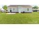 The home features a spacious backyard with healthy lawn and a small patio area near the back door at 15 Wright St, Rock Hill, SC 29730
